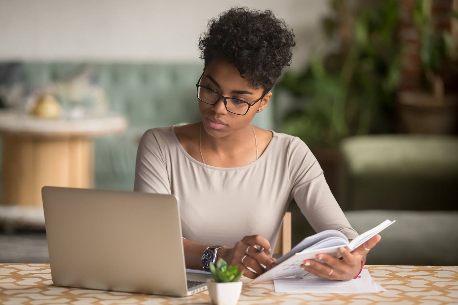 Woman sitting at a computer, taking an online assessment.