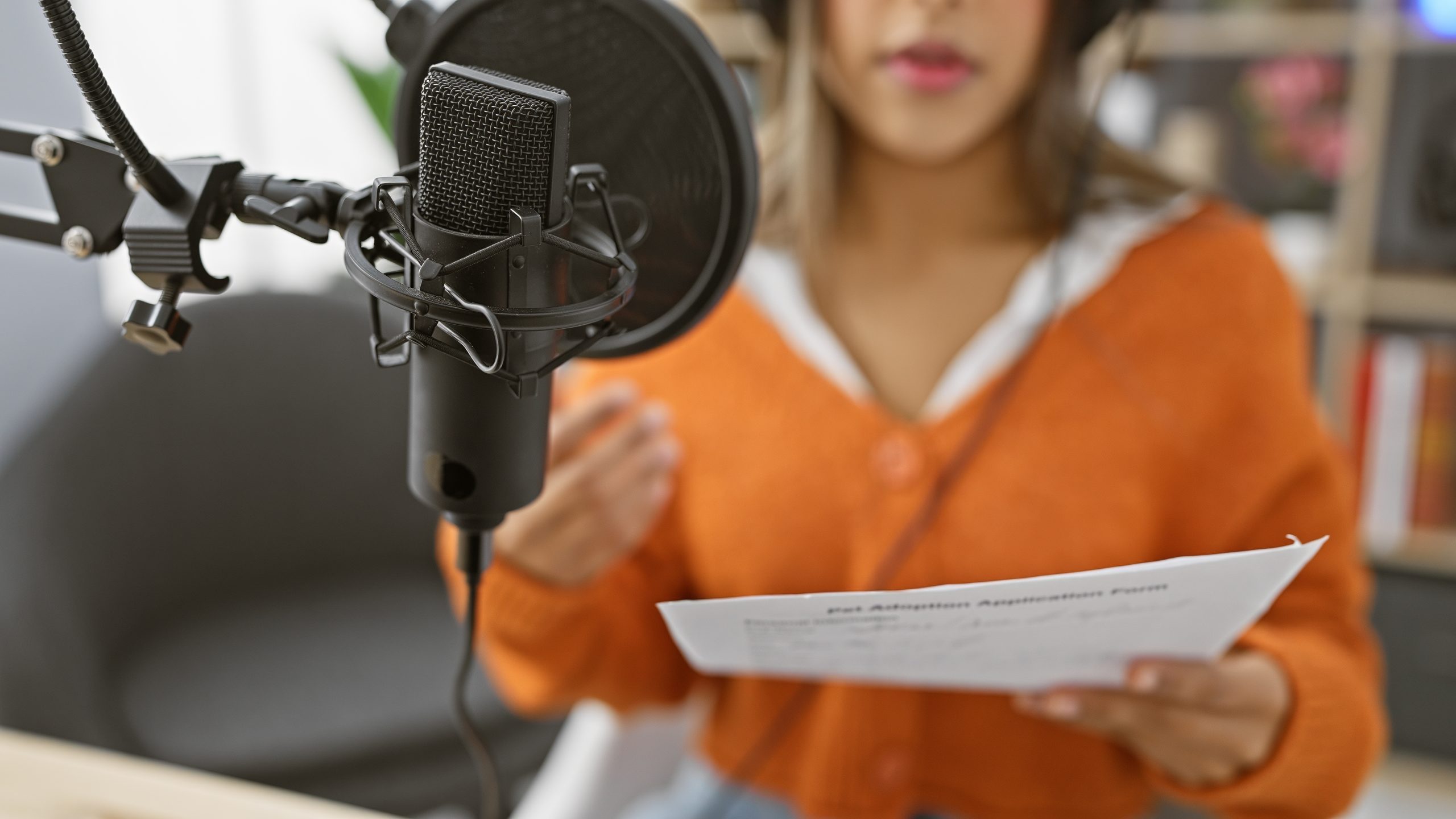 A,Young,Hispanic,Woman,Rehearses,Script,Indoor,At,A,Radio
